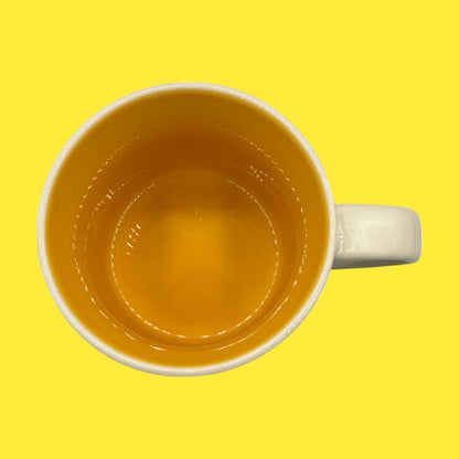 Bright yellow interior of the Florida Starbucks Mug, 15oz, You Are Here Collection - Replacement Mug ready for your coffee.