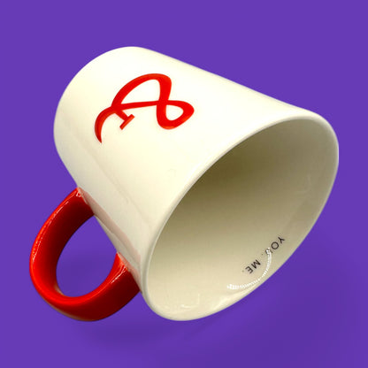 Starbucks You & Me mug features a white ceramic body with a red handle and ampersand, perfect for cozy moments.