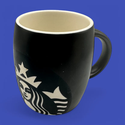 Sleek Starbucks Black ceramic mug featuring the iconic mermaid logo in a stylish black and white design.