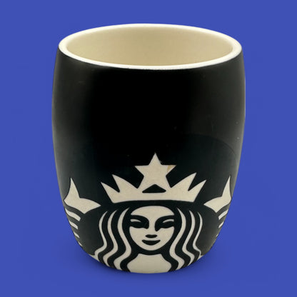 Stylish Starbucks Black ceramic mug featuring the iconic mermaid logo in a chic black and white design.