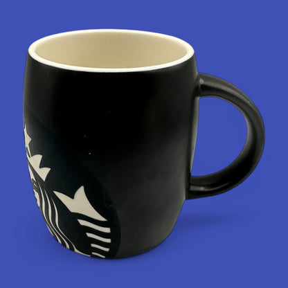 Sleek Starbucks Black ceramic mug featuring a stylish mermaid logo, perfect for your daily coffee ritual.