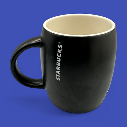 Starbucks Black ceramic mug featuring the iconic mermaid logo, perfect for enjoying your favorite brew.