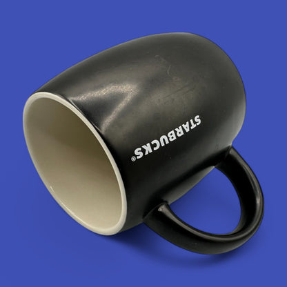 Starbucks Black ceramic mug featuring the iconic mermaid logo in a sleek, minimalist design for your daily brew.