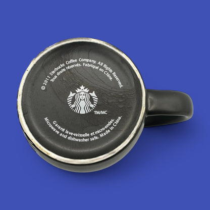 Starbucks Black ceramic mug with iconic mermaid logo, perfect for your daily brew in a sleek design.