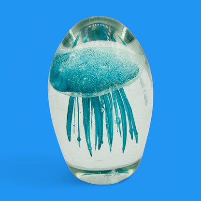 Teal Jellyfish Glass Paperweight - Vintage Charm - Glows in the Dark adds unique decor with its mesmerizing underwater scene.