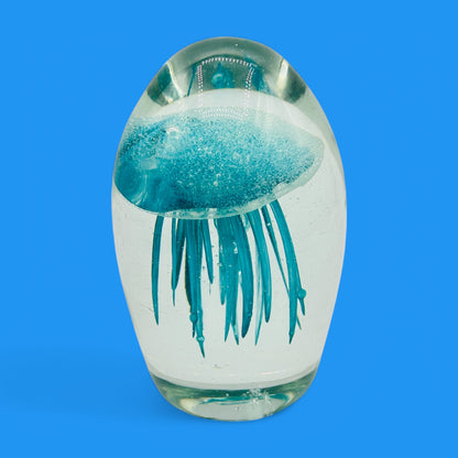 Teal Jellyfish Glass Paperweight - Vintage Charm - Glows in the Dark, showcasing an enchanting jellyfish in clear glass.