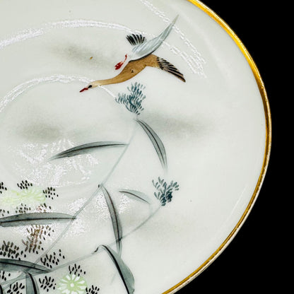 Vintage Japanese Crane Plate - Hand-Painted, Gold Rimmed, Signed features a graceful crane in flight on elegant porcelain.