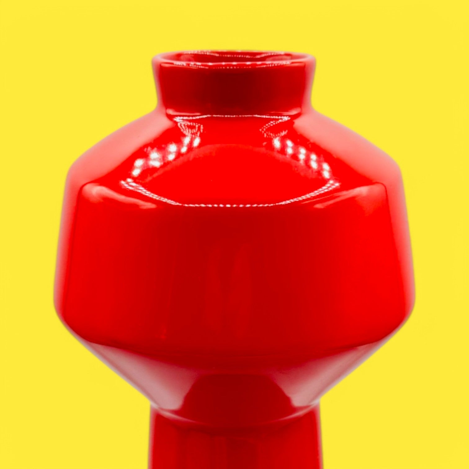 Brighten your space with the EQ3 Carnaby Red Vase, Mid-Century Modern Inspired Pop, showcasing a glossy, geometric design.