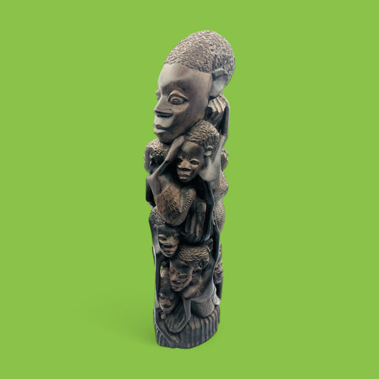 Explore the beauty of this Hand-Carved African Makonde Family Tree Sculpture / Carving Ebony Art, showcasing intricate details.