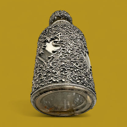 Antique ornate metal filigree perfume bottle with stopper
