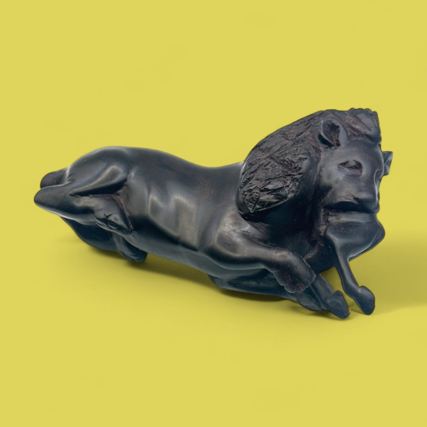 African Hand-Carved Ebony Lion with Prey Sculpture